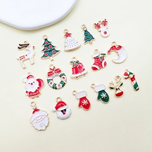 Collection of 17 colorful enamel Christmas charms including Santa, reindeer and tree