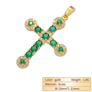 Gold-plated brass cross pendant with green zircon gemstones and white crystal accents