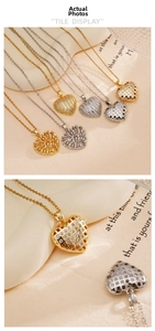 Detail of gold and silver heart pendants with hollow textures and zircon inlay
