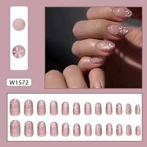 Pink press-on nail kit with floral art and shimmer finish, 24 pieces set in round shape