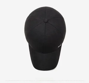 Top view of men's winter baseball cap with herringbone wool texture and metal accent