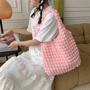 Pink bubble texture tote bag with soft polyester fabric shown in a lifestyle home setting