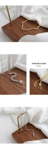 Macro detail of 925 sterling silver chain bracelets in gold and silver finishes