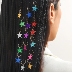 Colorful glitter star hair rings on braided hairstyle shown from a side view perspective