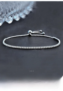 Detailed macro of S925 sterling silver tennis bracelet with moissanite stones