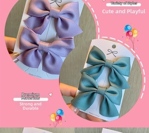 Close-up of cute lavender and sage green ribbon bow hair clips on card packaging