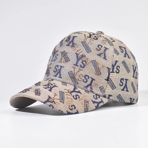 Detail of beige baseball cap featuring YS embroidery and sparkling rhinestone accents