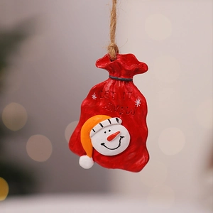 Detail of Let It Snow resin ornament with a snowman face and a rustic jute rope