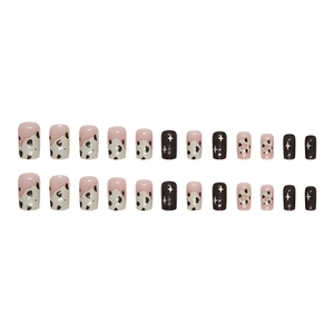 Chocolate donut style press-on nails featuring cow print and star designs in square shape