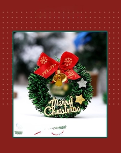 Mini star Christmas wreath with red bow, golden bells, and Merry Christmas sign