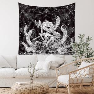 Detail of bohemian skull tapestry with alien skeleton art hanging over a white sofa