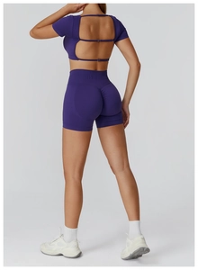 Deep purple seamless yoga set featuring a cutout back with straps and high waist shorts