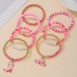 Pink western cowboy style beaded bracelet set with cowgirl charms and clay discs