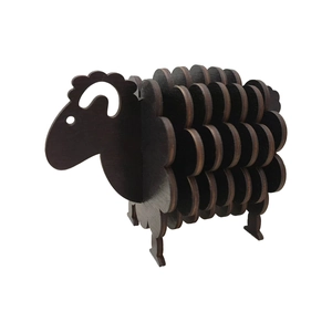 Detail of interlocking dark brown wooden sheep coasters and decorative home ornament