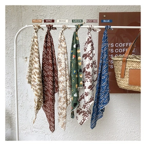 Selection of cotton linen neck scarves in six colors featuring delicate leaf patterns