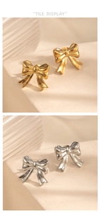 Detailed view of 3D bow earrings in polished gold and brushed silver finishes