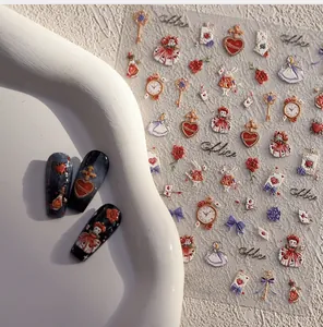 Detailed 3D relief nail art stickers featuring Alice and pocket watch motifs for DIY manicures