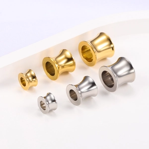 Polished gold and silver stainless steel ear gauges in various sizes for ear stretching