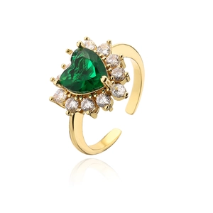 Detailed view of heart-shaped emerald zircon ring with gold plating and adjustable band