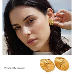 18k gold plated stainless steel textured knot earrings for women on model and white background