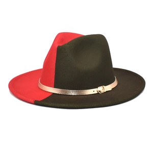 Detail of red and dark green fedora hat with gold metal buckle and wool felt texture