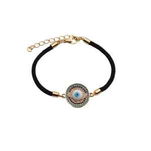 Detailed macro view of an evil eye charm with blue crystals on a black braided cord