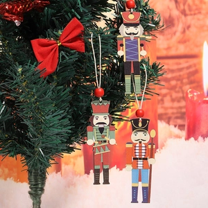 Three creative wooden nutcracker ornaments hanging on a festive decorated Christmas tree