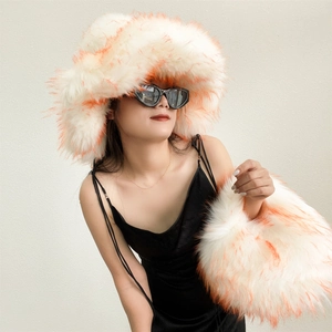 Detailed texture of oversized faux fox fur handbag with vibrant orange-red tipped fibers