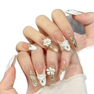 Elegant white floral press-on nails with lace relief, pearls, and rhinestones