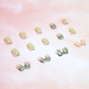 Summer press-on nails with lemon art, green gradients and 3D heart embellishments