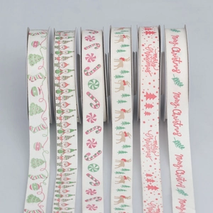 Detail of Christmas ribbons with festive patterns for gift wrapping and holiday decor