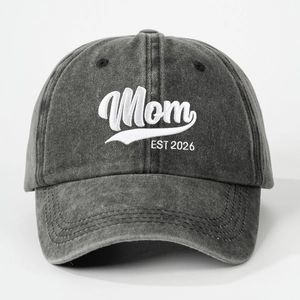 Washed dark gray baseball cap with white Mom EST 2026 embroidery on the front