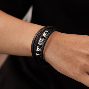 Men's multi-layered braided black leather bracelet with silver-tone metal accents
