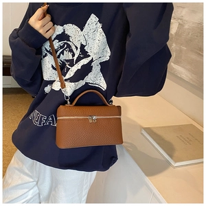 Brown litchi leather box handbag featuring double zippers and adjustable crossbody strap