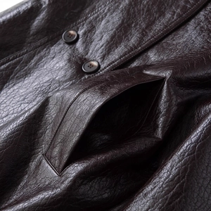 Women's dark brown PU leather jacket with stand collar, double-breasted buttons and texture