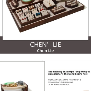 Detail of walnut wood jewelry display set with beige microfiber lining for various gems