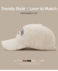 Detail view of beige teddy fleece baseball cap showing side profile and embroidery texture