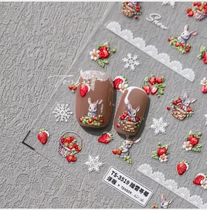 Macro detail of 5D embossed strawberry and bunny nail art stickers TS-3519 on nails