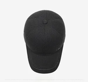 Top view of a black winter baseball cap with thick knit texture and sport metal logo