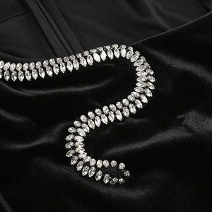 Close-up of sparkling marquise rhinestones on black velvet dress with hidden zipper
