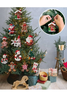 Close-up of assorted polymer clay Christmas tree ornaments including gingerbread men and Santa