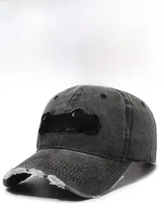 Detailed view of the distressed brim and Purist embroidery on a washed denim baseball cap