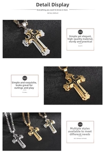 Macro detail of cross pendants in gold, silver and black with Byzantine chain link