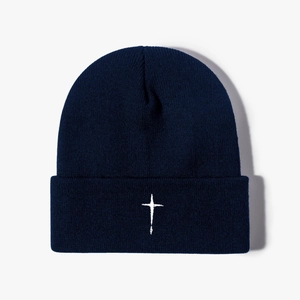 Unisex navy blue knitted beanie with white cross embroidery and classic folded cuff design