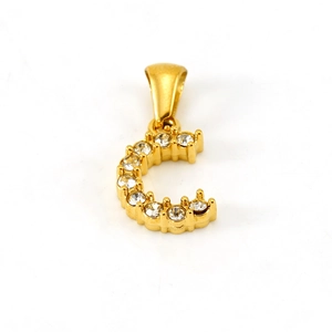 Detailed macro view of a gold-plated letter C pendant with sparkling white zircons