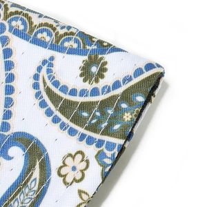 Detailed close-up of paisley pattern on a quilted bucket hat with neat white stitching