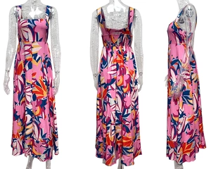 Detail view of pink floral summer dress showing elastic smocked back and long A-line hem