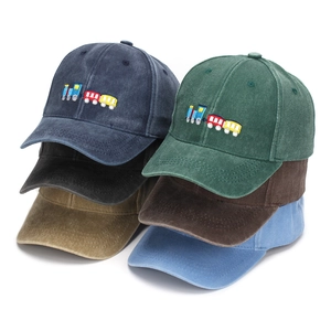 Set of six washed cotton kids baseball caps with colorful train embroidery in various colors