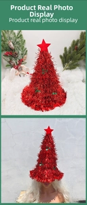 Close-up of red tinsel Christmas tree hat with star topper and green sequins detail