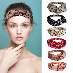 Detail showing various colors of ethnic lace headbands including beige, black and pink